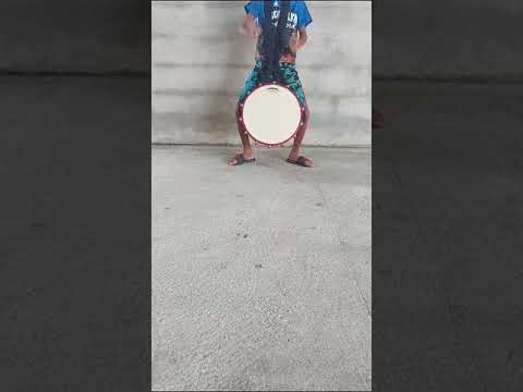Sanjeev preforming the tikora hand on a tassa drum