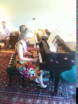 Karin Graves plays the opening song with Bill's piano teacher