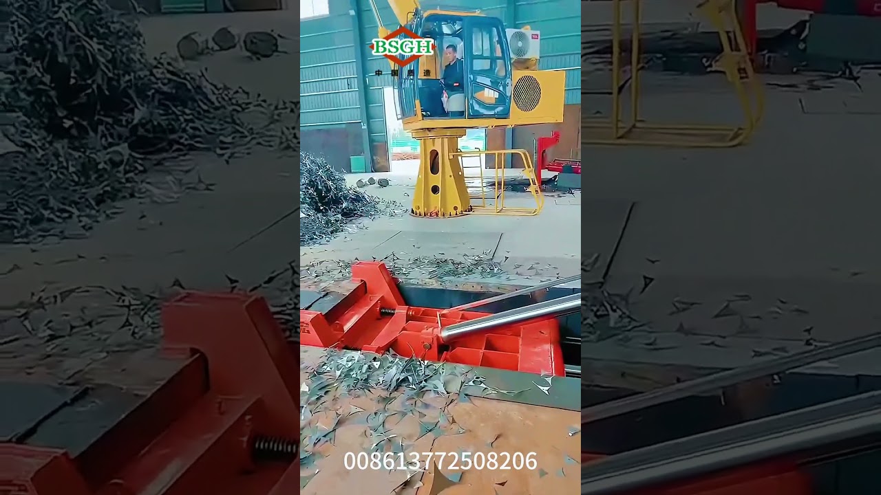 Excavator Grapple Feed metal chip to Mini Baler