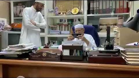 42 years later.... Sheikh Ali Mulla, Mua’dhin of Masjid Al Haram, watching an old video of himself c