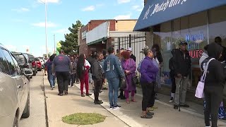 Crowds line up for the opening of Dutch Girl Donuts