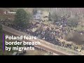Poland steps up patrols as migrants attempt to cross border with Belarus