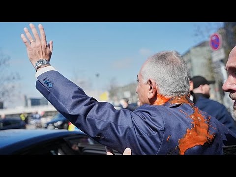 Iran's exiled crown prince Reza Pahlavi splattered with red liquid