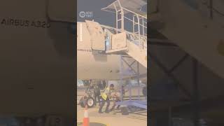 Airport Worker Falls From Plane At Airport In Indonesia | 10 News First