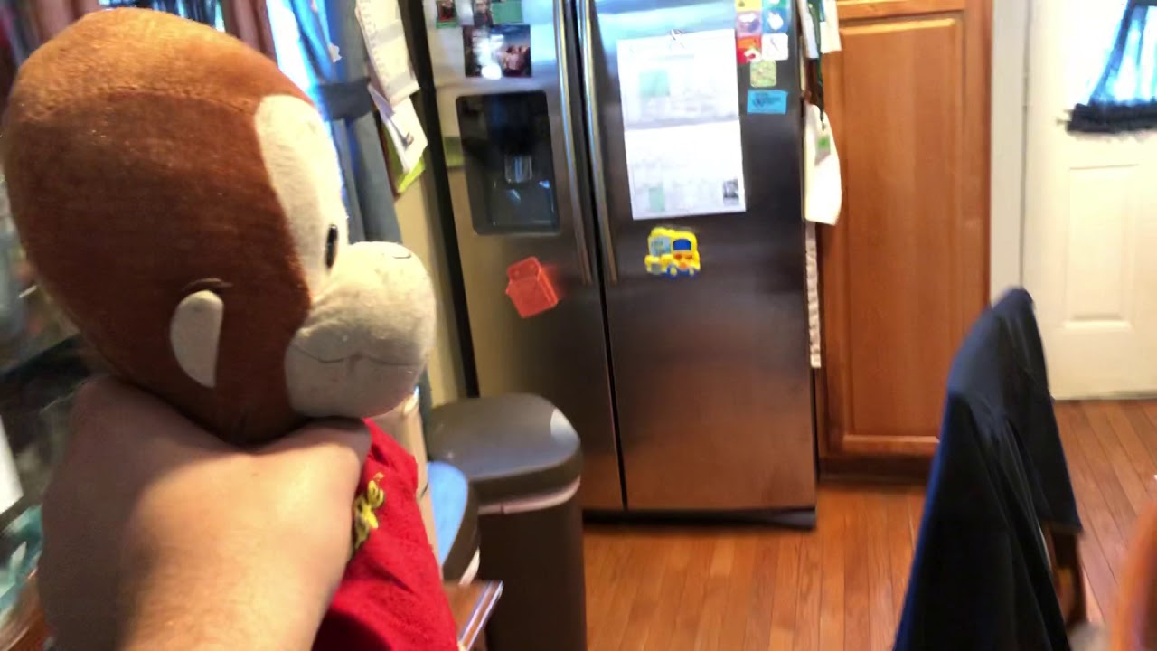 Curious George steals candy and gets arrested