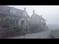 A cold misty  mysterious early morning walk through a cotswold village  countryside