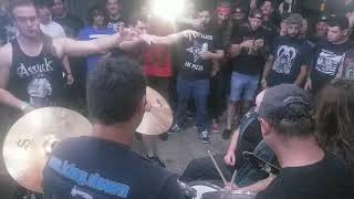 Zealot R.I.P. sets up the drum kit in the pit