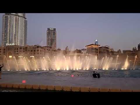 Dubai burj khalifa water light show during evening time
