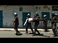 Comores  des gendarmes vacuent un bless lors dune manifestation de lopposition  afp images