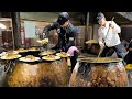 Le plus clbre pilaf de boukhara sophie dans deux grandes marmites en cuivre l pour 1000 personnes