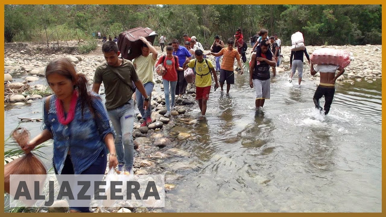 🇻🇪 الفنزويليون اليائسون يعبرون نهر تاتشيرا من أجل البقاء | الجزيرة الانجليزية