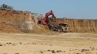 Transporting The 100 Tones Dumper loading OB Transport Dump komastu 1200-Excavator By Side-Komastu