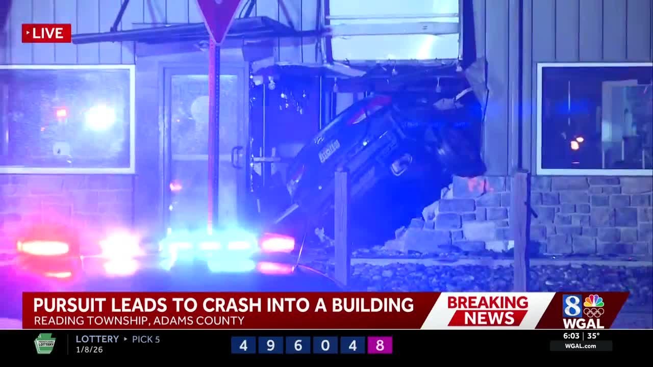 Police chase ends with vehicle lodged into Adams County building - YouTube
