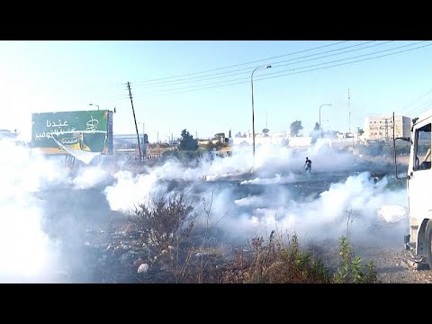 Palestinians rally near DCO checkpoint in Ramallah