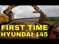 Loading out base rock with Hyundai 145 excavator