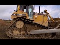 CAT D6 dozer at work levelling stone on a road construction site #2