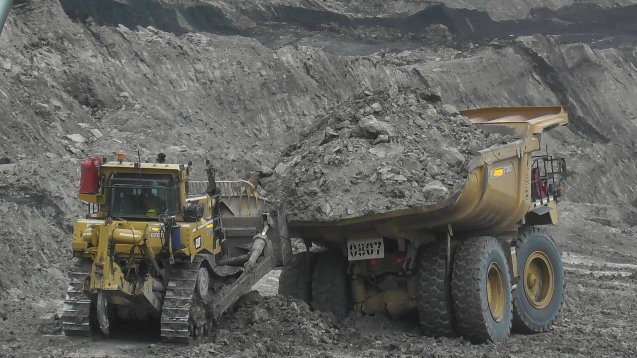 Caterpillar D8R Dozer Assisting CAT 777 Dumper at Hitachi EX2600 Excavator Loading Area