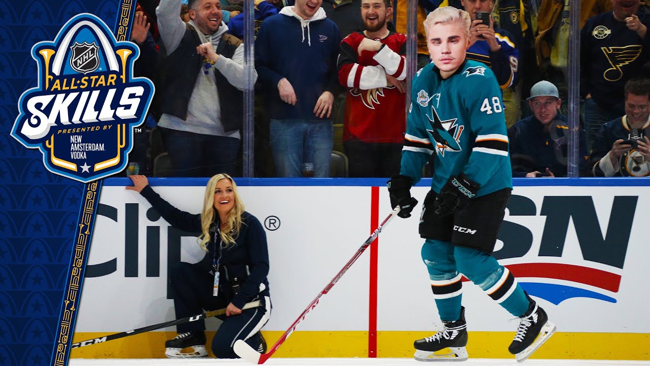 Justin Bieber gets hit, but shows skills in celeb hockey game