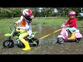 Max and Katy stuck in mud on the motorbike