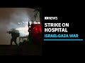 Israeli troops raid Gaza hospital, UN says famine 
