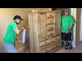 Shrink wrapping a large dresser.