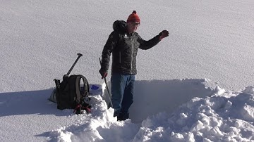 Avalanche experts demonstrate snow stability test to gauge avalanche risk