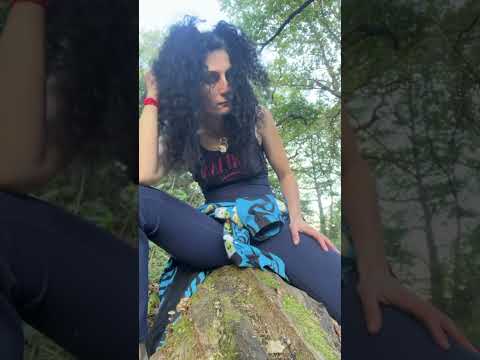 Barefoot grounding woodland tree trunk, moss and mushrooms