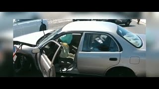 Trooper comforts young girl at scene of crash