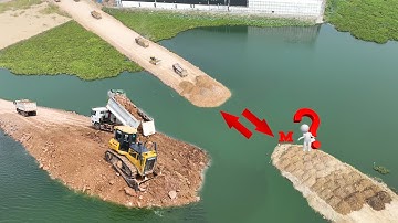 Nice Nearly Complete Water Road Project Talent Driver Faster Bulldozer Pouring Soil ,Truck Unloading