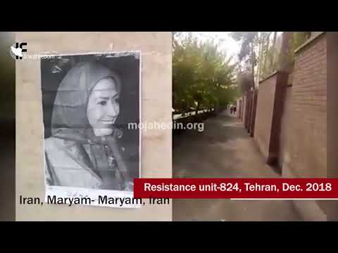 Putting up the posters of Masoud and Maryam Rajavi in Tehran