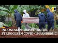 Heavy workload of gravediggers in Indonesia points to under-reported coronavirus death toll