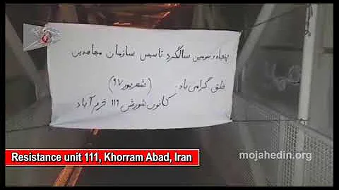 Khorram Abad, Iran, Resistance Unit 111 putting up the banner of the PMOI MEK on the 53rd founding a