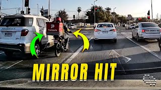 Motorcyclist Hits Vehicle's Mirror