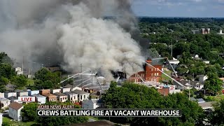 Multiple crews fighting fire at vacant warehouse in Louisville's Smoketown neighborhood
