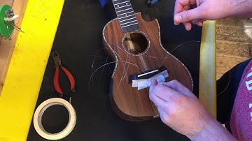 How to restring a Snail or Kala Elite Ukulele (pull through Ukulele bridge)