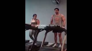 Girl spots an attractive hunk on the treadmill next to her and suddenly posture changes,