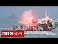 Dozens of French boats protest off Jersey in row with UK over fishing rights - BBC News