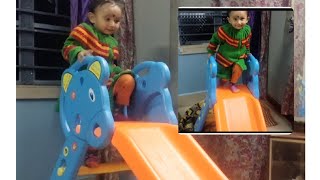 Baby playing slide for the first time,  indoor game fun