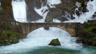 Powerful raging river flows under the bridge (Nature Sounds)