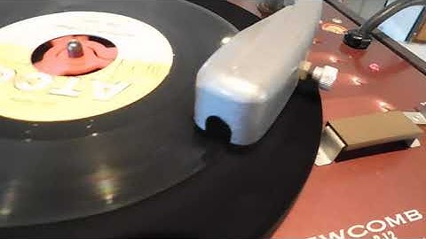 Newcomb record player,  playing a 45 Rpm record.