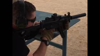 Full auto MP5 with M.A.C. Precision propritary suppressor