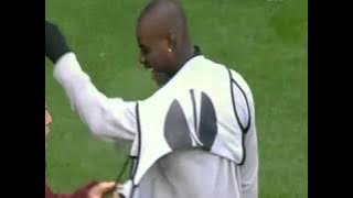 Mario Balotelli can't get his bib on
