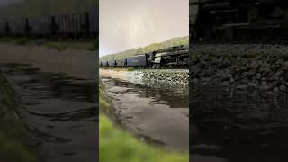 HO Scale NKP 2-8-4 rolls by pond with a nice reflection. Resimi