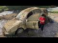 The girl rescued the muddy car from the sewer and repaired it