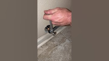 Installing a new compression quarter turn angle stop and stainless steel braided supply line.