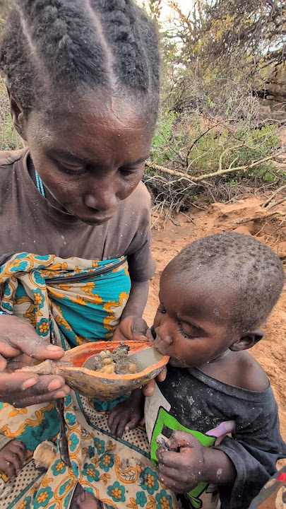 Wow,,,🤩A mother feeding her child's food, bushmen Lifestyle#africa #african #animals