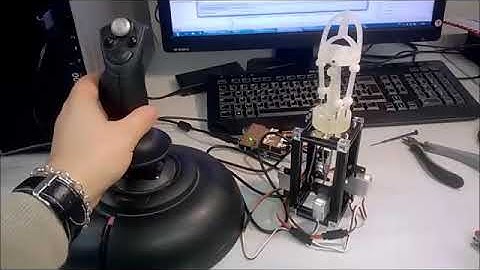 4-DoF spherical parallel wrist with embedded grasping capability for minimally invasive surgery