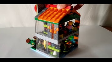 "Top" Lego modular hat and wig shop moc. Roof made from Lego separator.
