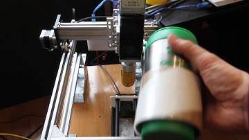 Engraving on a coffee thermos using 10 watt DPSS laser and using rotary system (a axis)