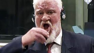 War Criminal Commits Suicide In Court